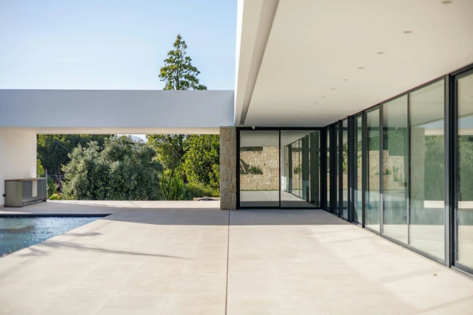 Modern house with pool and large glass windows