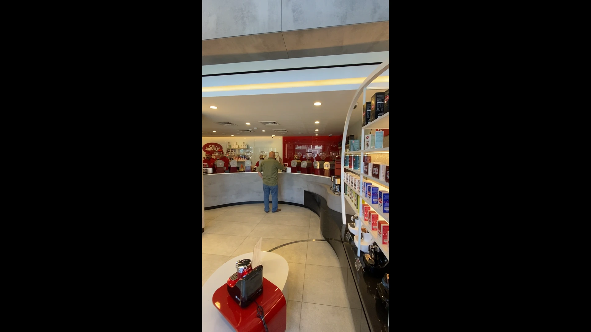 5. Interior corner of the shop showing a modern open layout and functional spaces.